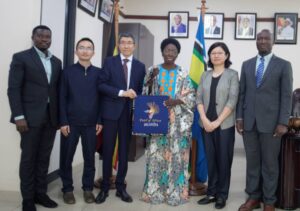 RtHon.Rebecca Alitwala Kadaga in the centre holding the African Kitege Bag pose in a group photo after the meeting with Prof.Li Xiaoyun is next to her from the left. Others include Prof. Xu Jin Proff.Wang, Antony Mula DG BCD and Counsel Anthony Buwande .