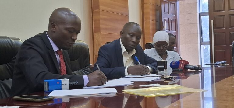 Anthony Mula, Director General of the Busoga Consortium for Development, and Wamboga Nicholas, Director of The Was Company Ltd, sign the UGX 126 million Rainbow Chicken Project agreement aimed at boosting household incomes in Busoga.”